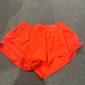 Orange lululemon shorts low rise 2.5 inches size 4